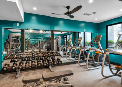 gym at the quarters on campus apartments