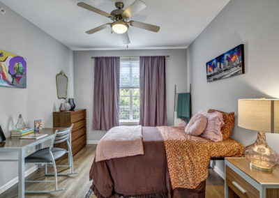fully furnished bedroom at the quarters on campus apartments
