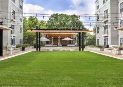 Courtyard with large grass area and grilling station